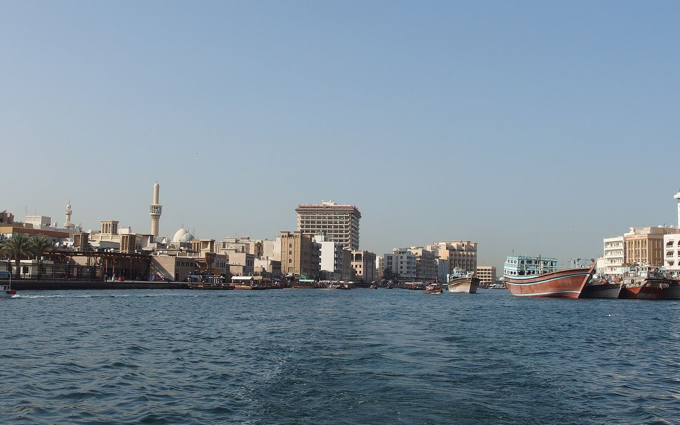 Traditional dhows and the Deira waterfront on Dubai Creek, Dubai, UAE