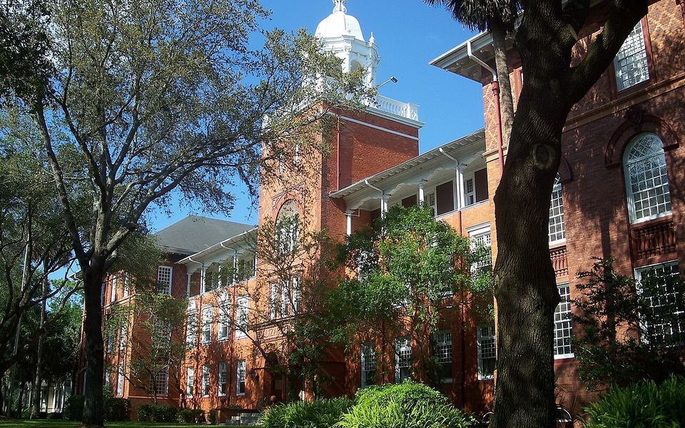 Elizabeth Hall, a red-brick building with a white cupola, among the trees of Stetson University&rsquo;s campus in DeLand, Florida